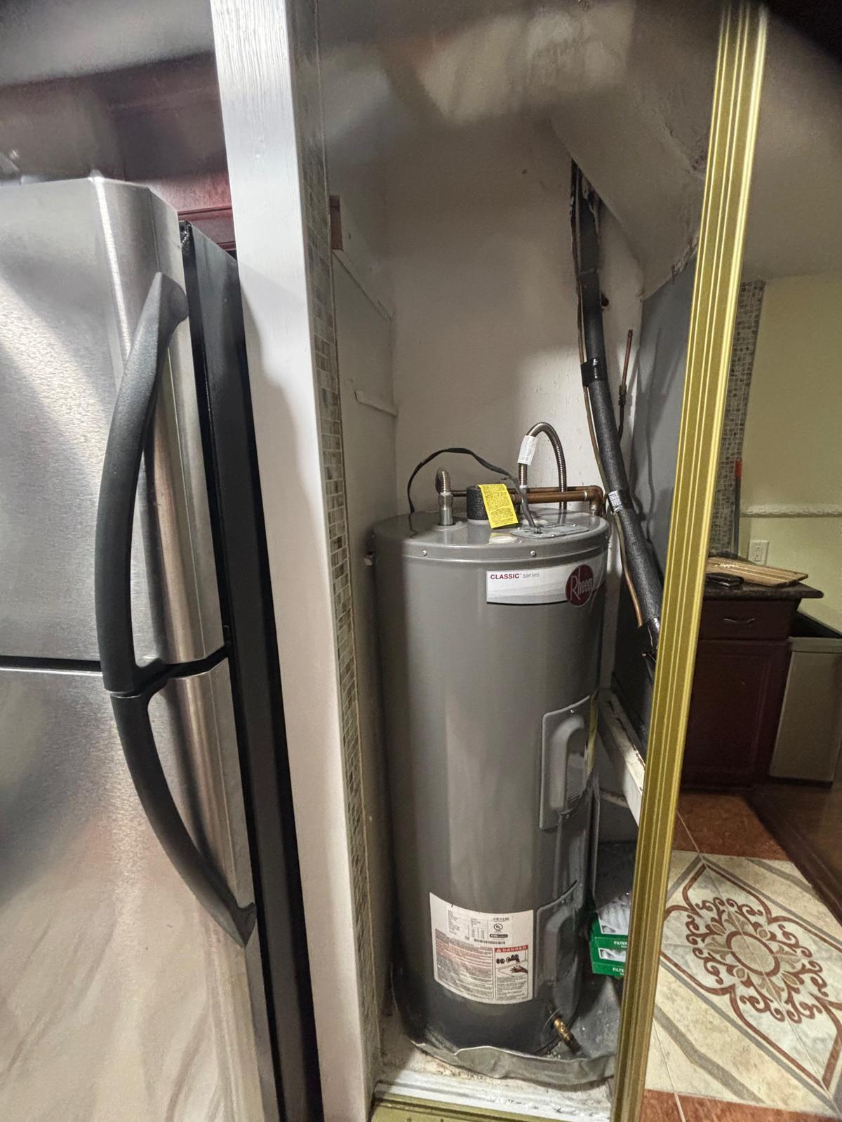 2151 Northeast 42nd Court, Unit 221 Lighthouse Point, FL 33064 - Photo 16 of 31 a view of water heater room washer and dryer