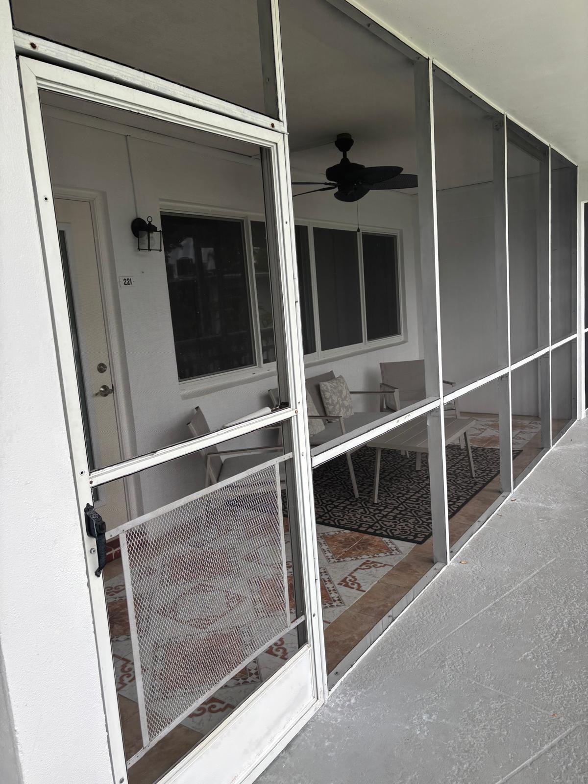 2151 Northeast 42nd Court, Unit 221 Lighthouse Point, FL 33064 - Photo 17 of 31 a room with rack on the wall