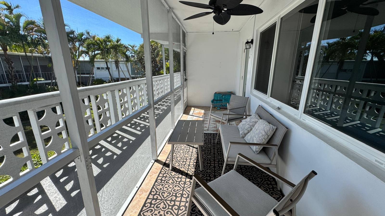 2151 Northeast 42nd Court, Unit 221 Lighthouse Point, FL 33064 - Photo 19 of 31 a view of balcony with wooden floor