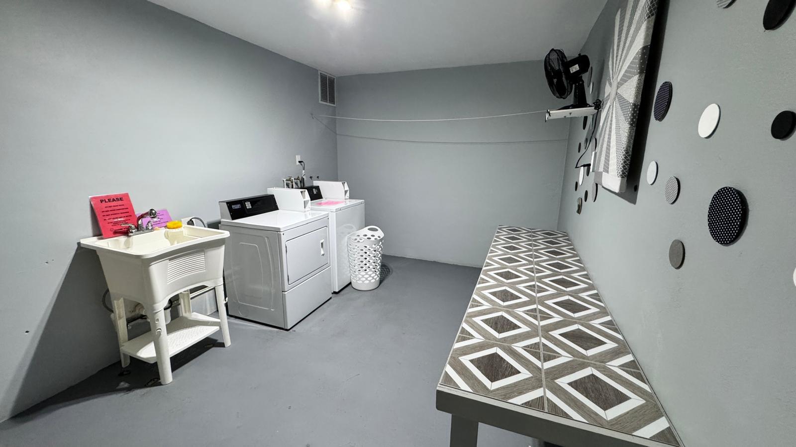 2151 Northeast 42nd Court, Unit 221 Lighthouse Point, FL 33064 - Photo 20 of 31 a utility room with dryer and washer