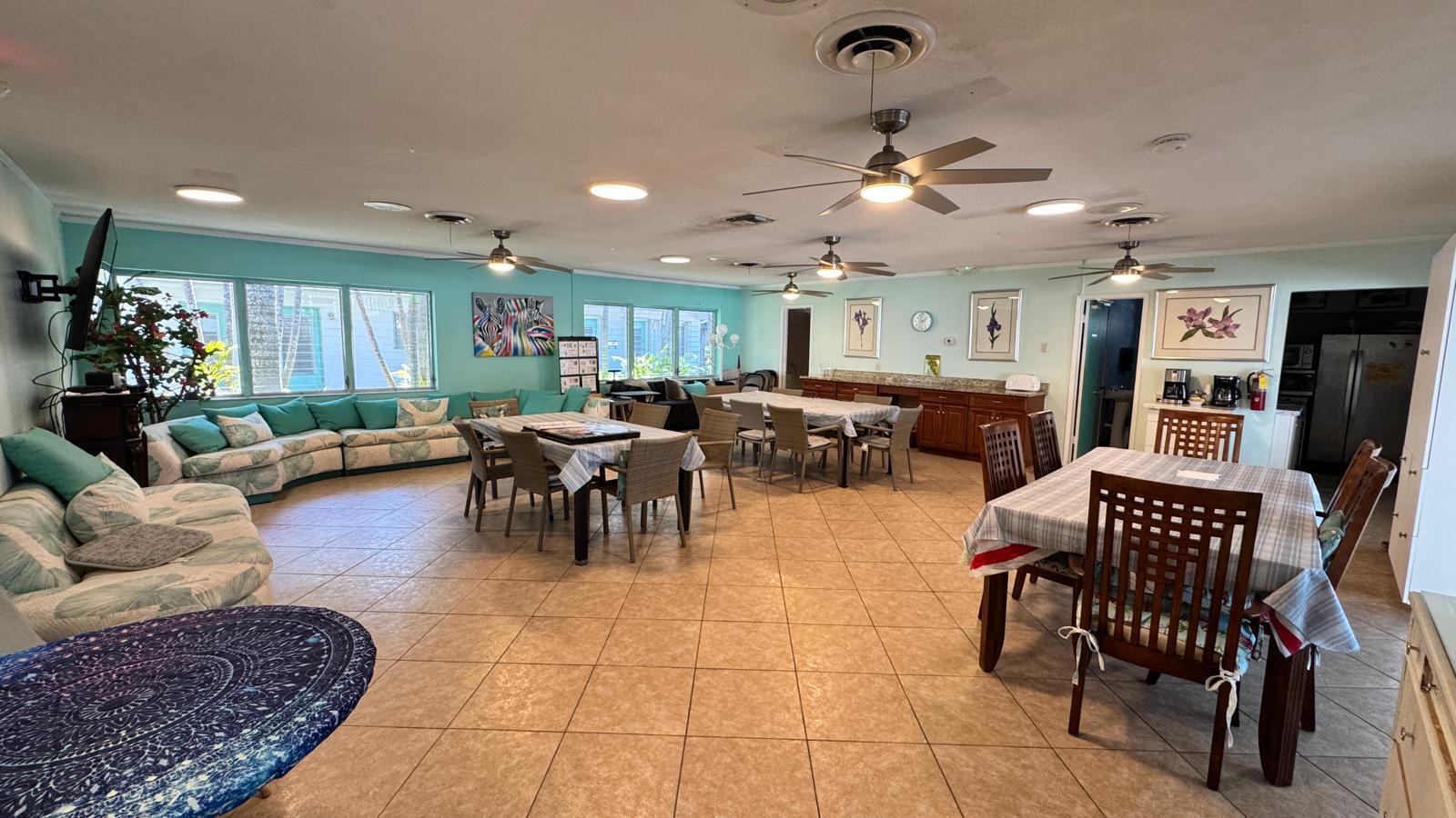 2151 Northeast 42nd Court, Unit 221 Lighthouse Point, FL 33064 - Photo 27 of 31 a living room with lots of furniture and kitchen view