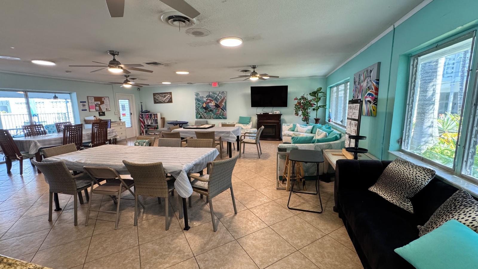 2151 Northeast 42nd Court, Unit 221 Lighthouse Point, FL 33064 - Photo 28 of 31 a view of a dining room with furniture