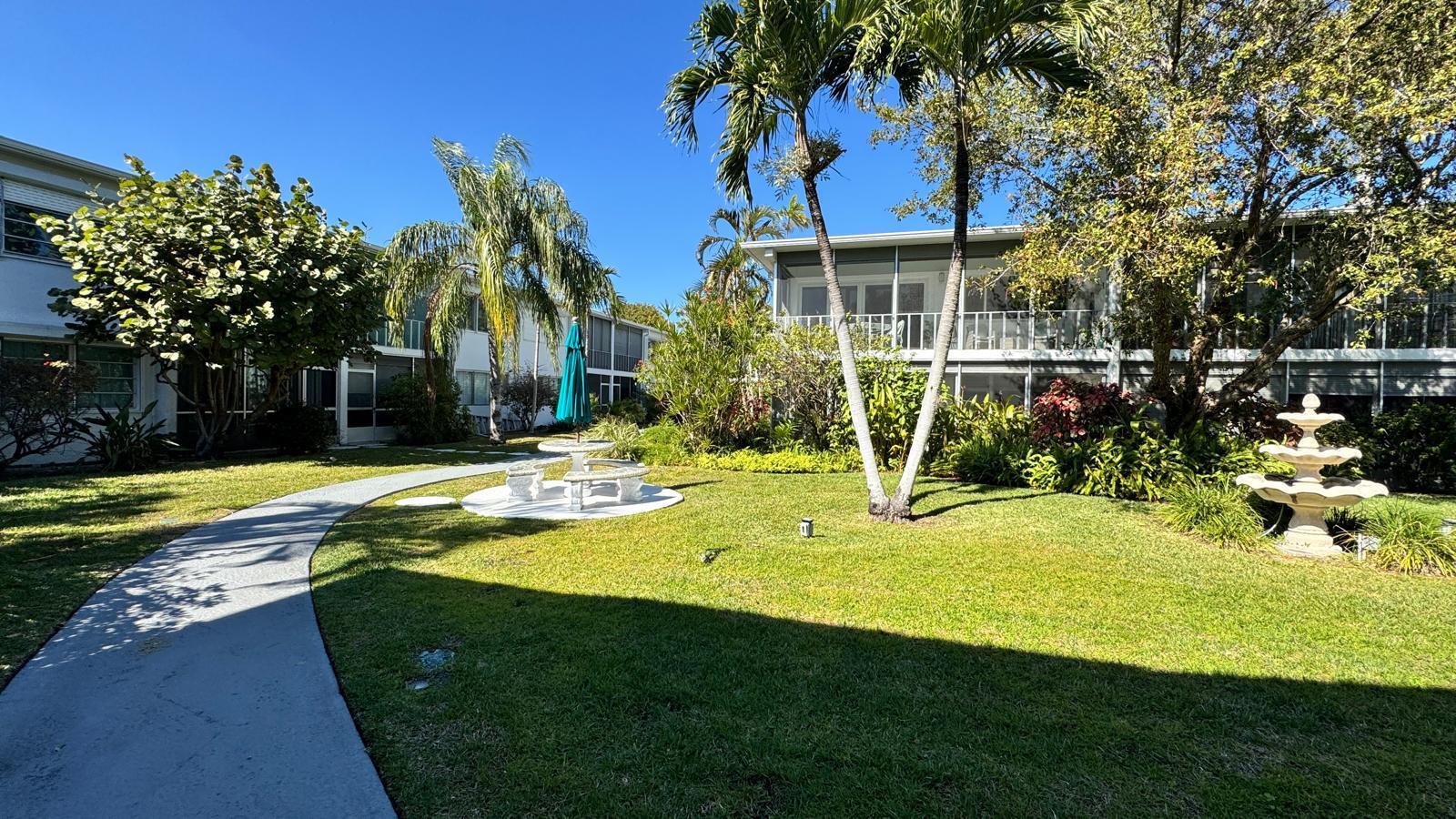 2151 Northeast 42nd Court, Unit 221 Lighthouse Point, FL 33064 - Photo 31 of 31 a view of a house with swimming pool and sitting area