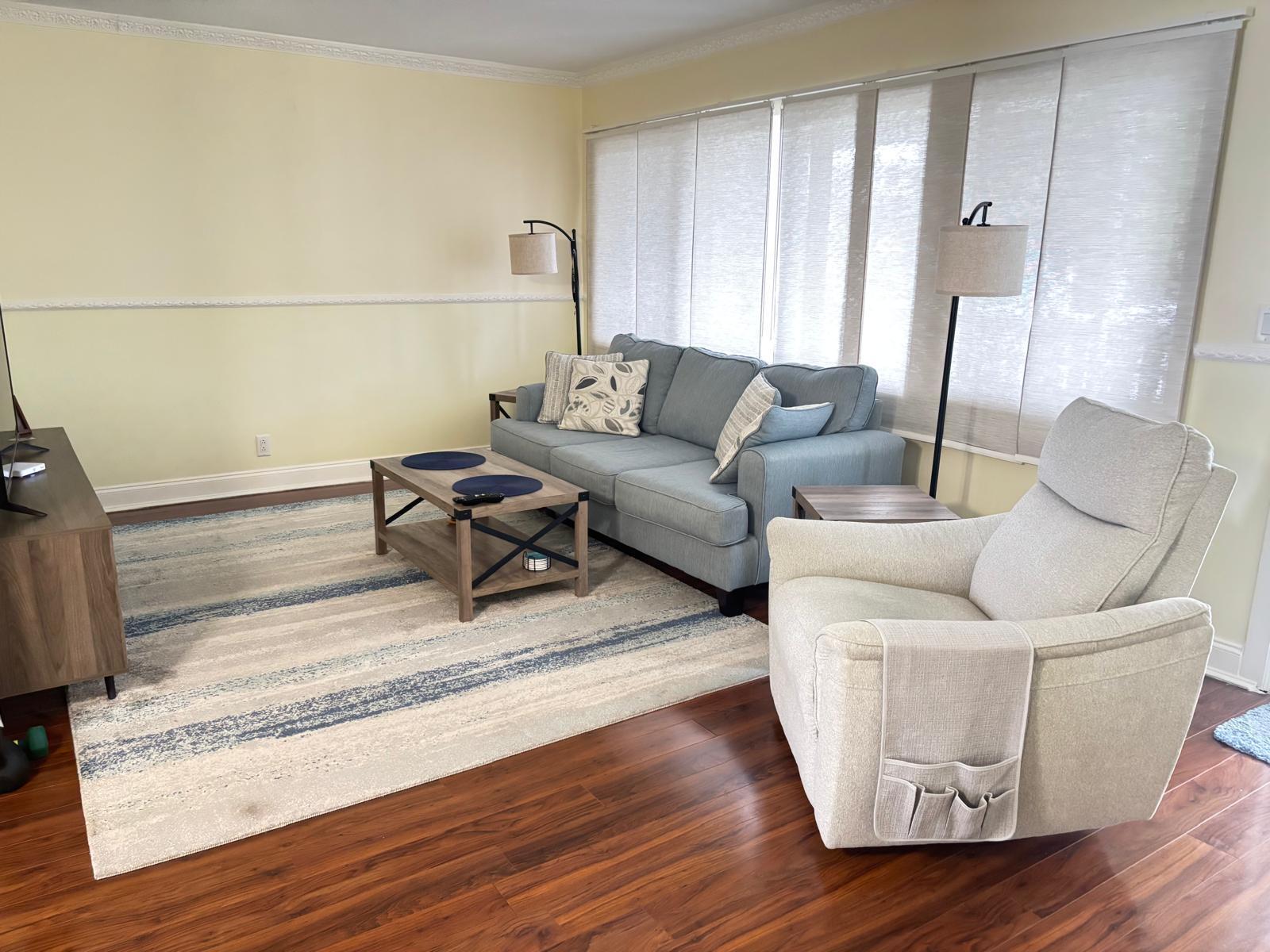 2151 Northeast 42nd Court, Unit 221 Lighthouse Point, FL 33064 - Photo 8 of 31 a living room with furniture and wooden floor