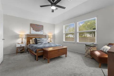 a bedroom with a bed and a couch