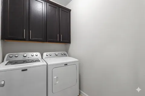 a kitchen with sink and refrigerator