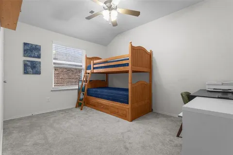 a bedroom with furniture and a window