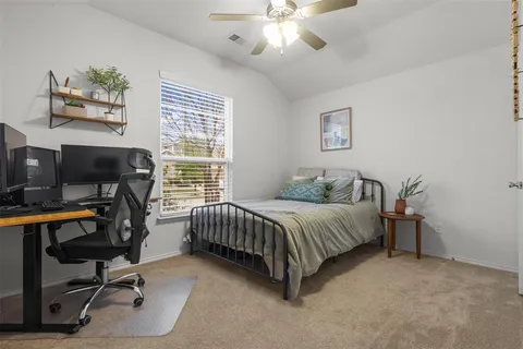 a bedroom with bed and a window