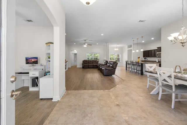 a view of kitchen with furniture and wooden floor
