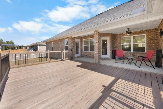 a view of a swimming pool with a yard