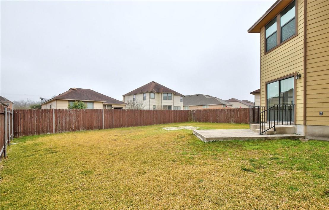 356 Matthews Kyle, TX 78640 - Photo 19 of 30 A spacious, fenced backyard offers privacy and room for outdoor activities.