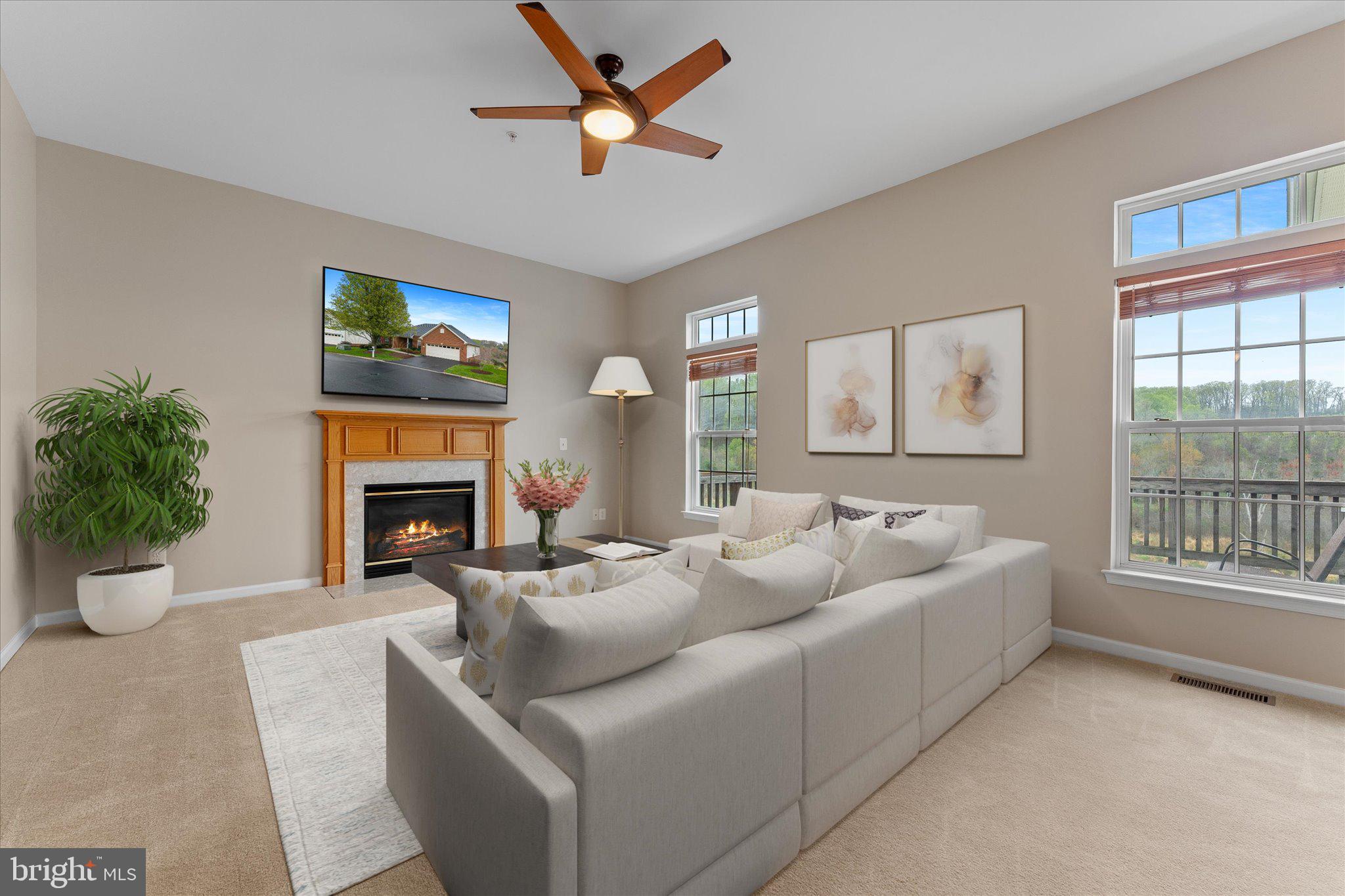 6696 Stream View Lane Warrenton, VA 20187 - Photo 19 of 57 a living room with furniture and a fireplace