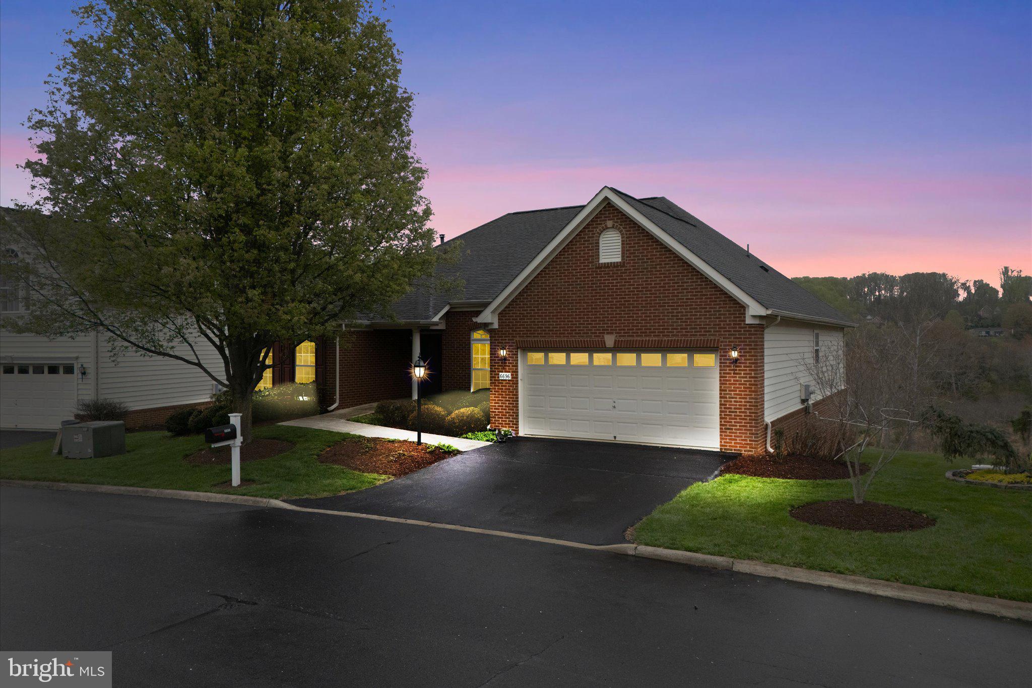 6696 Stream View Lane Warrenton, VA 20187 - Photo 2 of 57 a front view of a house with a yard and garage