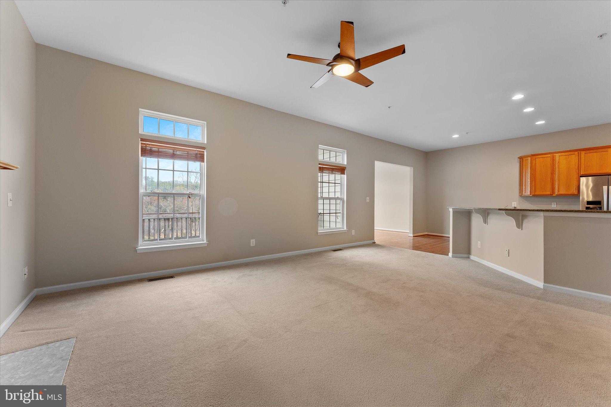 6696 Stream View Lane Warrenton, VA 20187 - Photo 21 of 57 a view of a livingroom with a ceiling fan and window