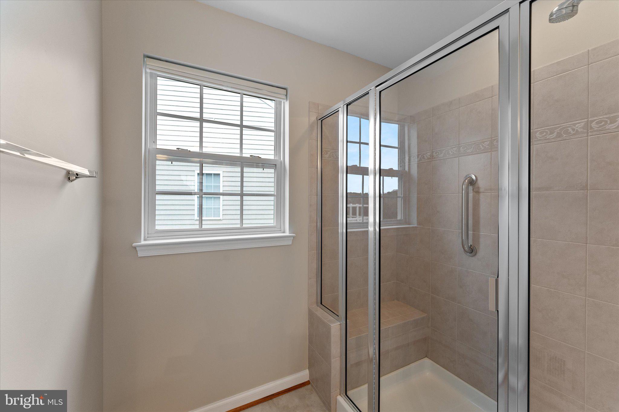 6696 Stream View Lane Warrenton, VA 20187 - Photo 29 of 57 a bathroom with a glass shower door