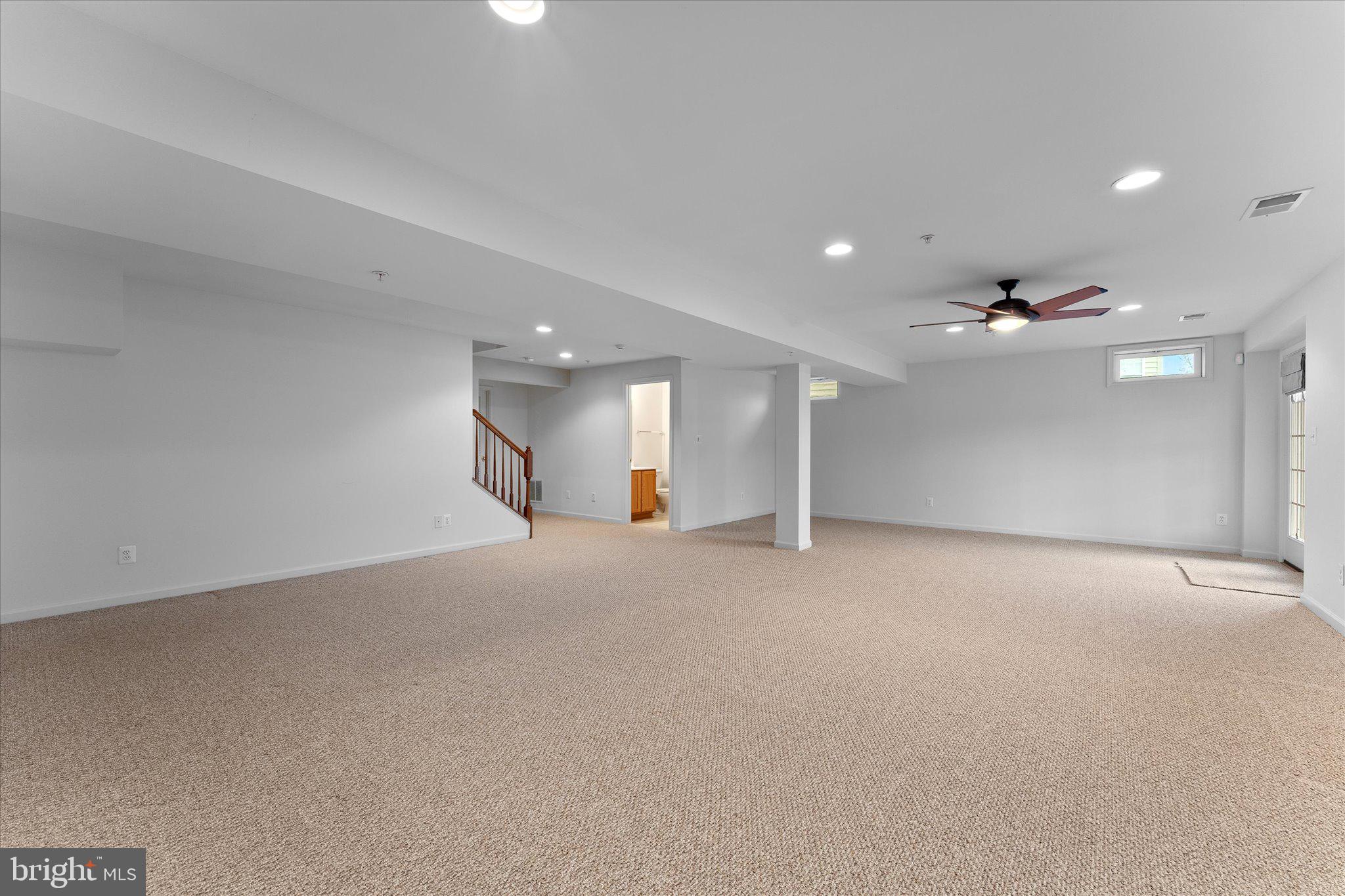 6696 Stream View Lane Warrenton, VA 20187 - Photo 39 of 57 an empty room with an entryway and fan