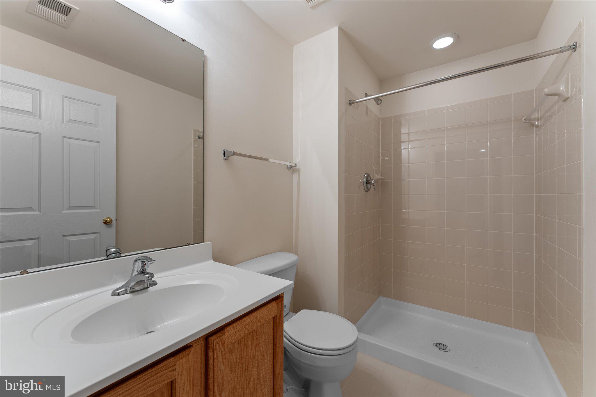 6696 Stream View Lane Warrenton, VA 20187 - Photo 42 of 57 a bathroom with a sink toilet and shower