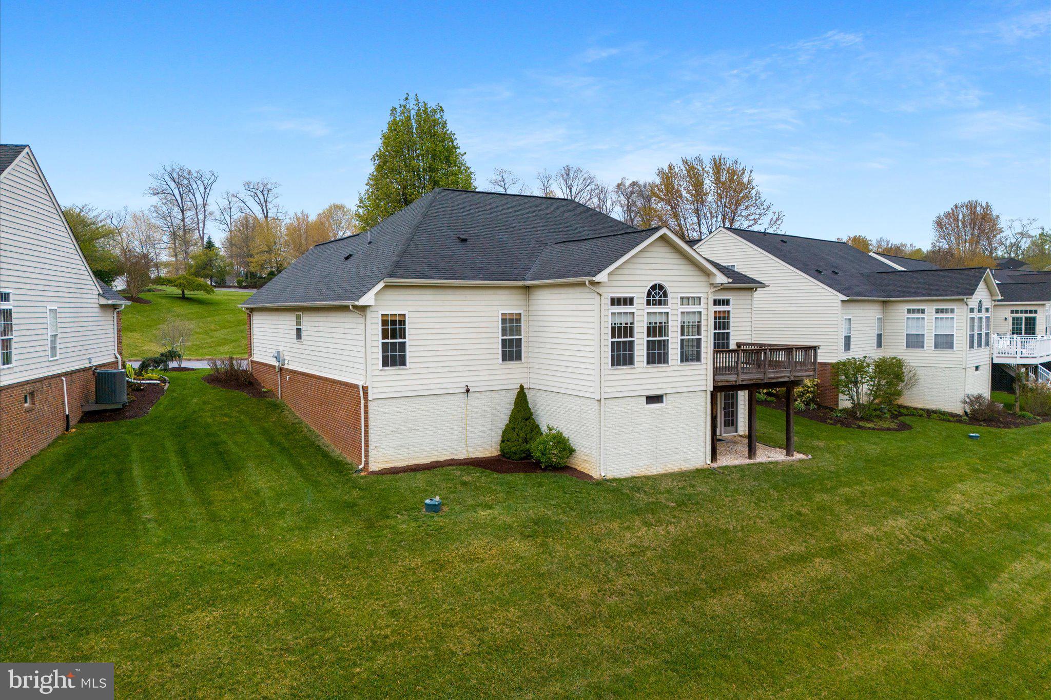 6696 Stream View Lane Warrenton, VA 20187 - Photo 46 of 57 a front view of a house with a garden and yard