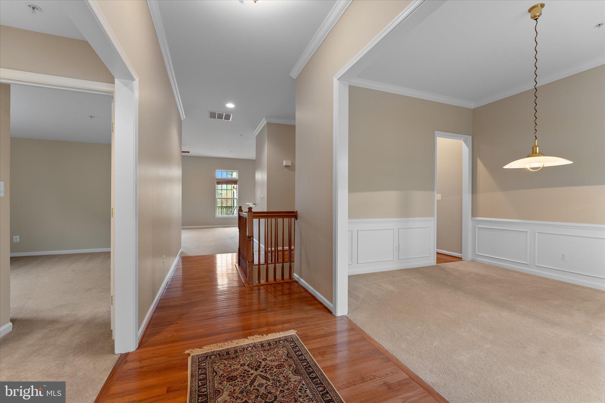 6696 Stream View Lane Warrenton, VA 20187 - Photo 5 of 57 a view of a hallway with a chandelier