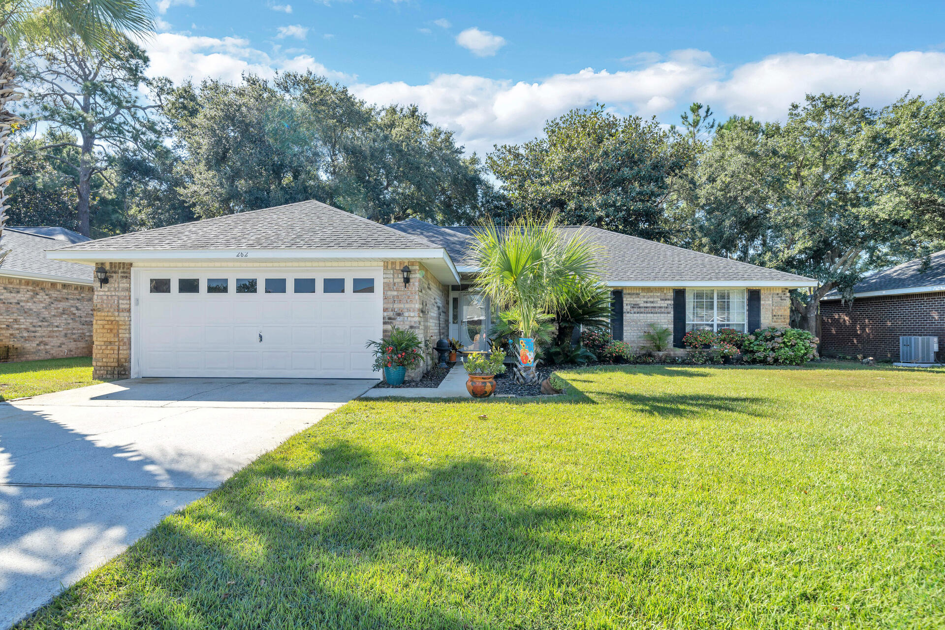 262 Beacon Way Miramar Beach, FL 32550 - Photo 1 of 42 a view of a house with swimming pool and a yard