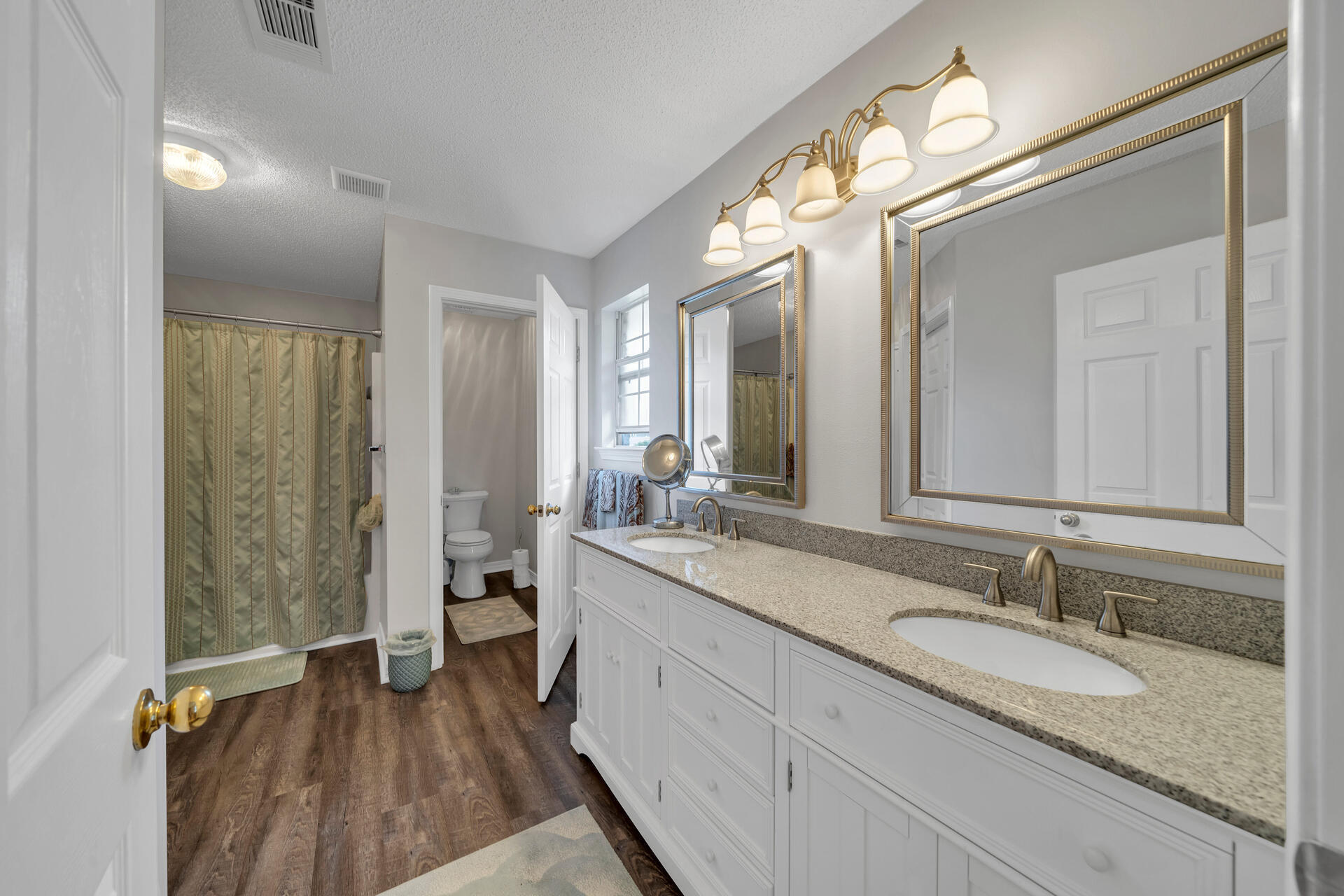 262 Beacon Way Miramar Beach, FL 32550 - Photo 24 of 42 a bathroom with a granite countertop sink mirror and a shower