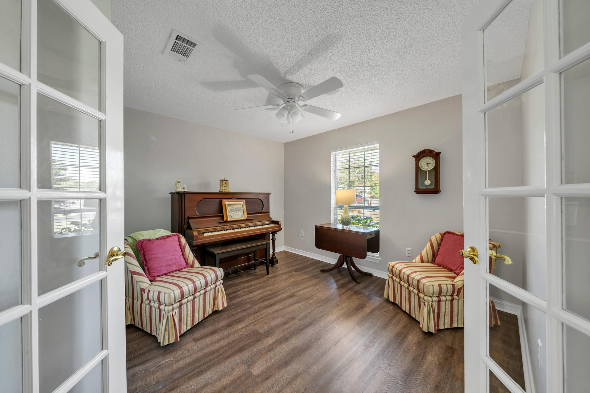 262 Beacon Way Miramar Beach, FL 32550 - Photo 27 of 42 a living room with furniture fireplace and a window
