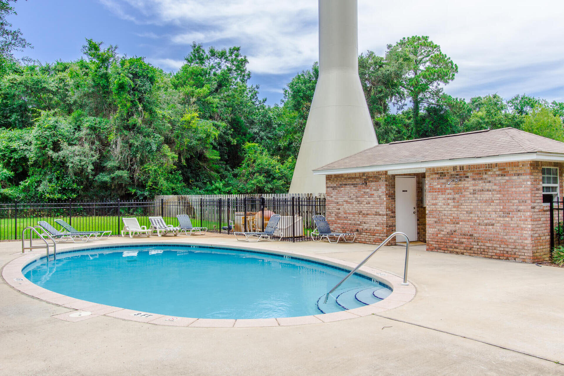 262 Beacon Way Miramar Beach, FL 32550 - Photo 42 of 42 a view of a swimming pool with a yard