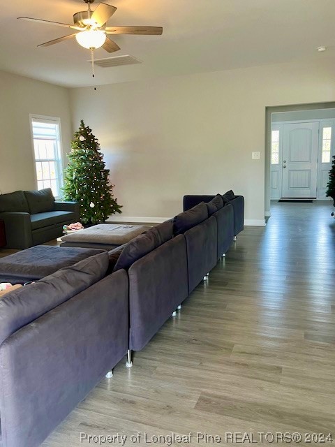 392 Buffalo Creek Road Raeford, NC 28376 - Photo 12 of 34 a living room with furniture and a chandelier
