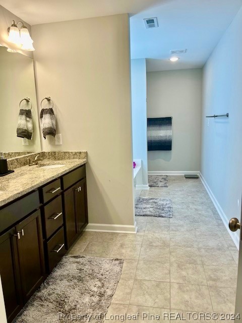 392 Buffalo Creek Road Raeford, NC 28376 - Photo 17 of 34 a bathroom with a sink and a mirror