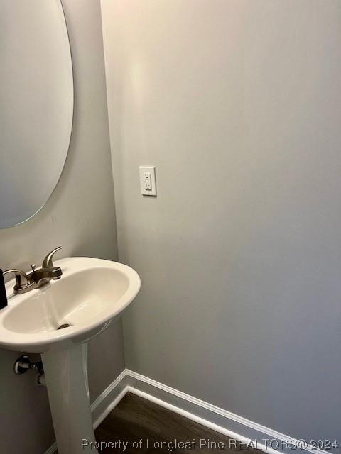 392 Buffalo Creek Road Raeford, NC 28376 - Photo 8 of 34 a bathroom with a sink and a mirror