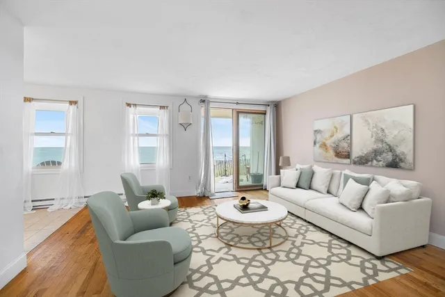 a view of empty room with wooden floor and window