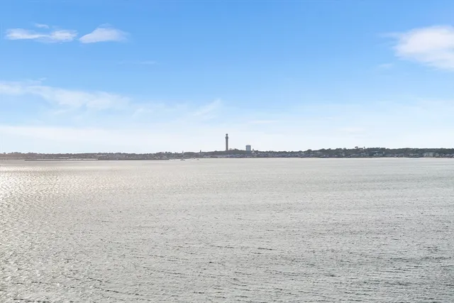 a view of a brick house with a deck