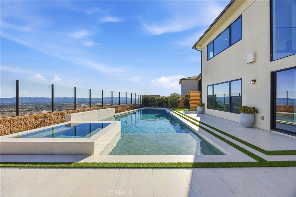 20138 Marlow Lane Porter Ranch, CA 91326 - Photo 33 of 39 a view of a swimming pool with a lounge chairs