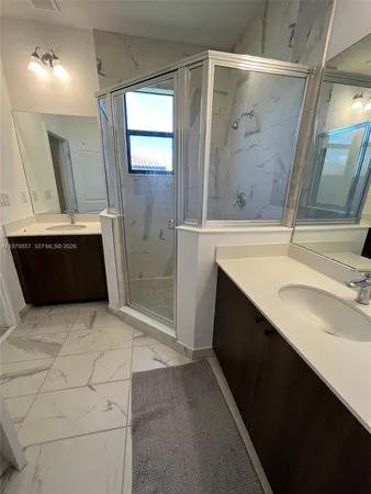 a view of storage and utility room with wooden floor