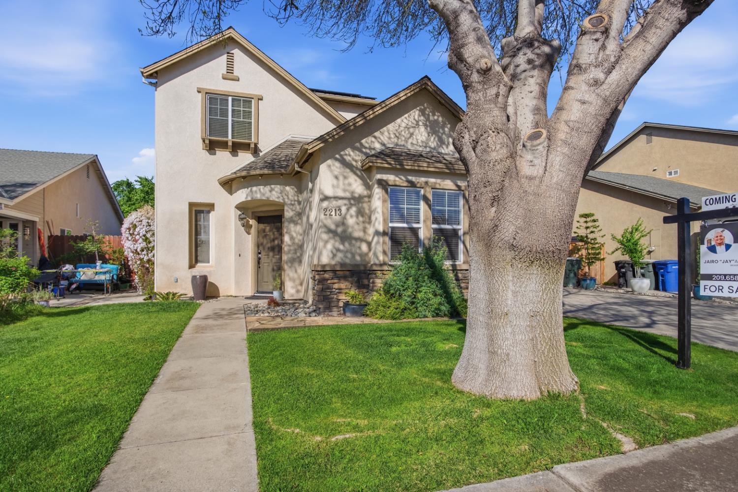 2213 Lionudakis Court Modesto, CA 95355 - Photo 2 of 38 a front view of a house with a yard