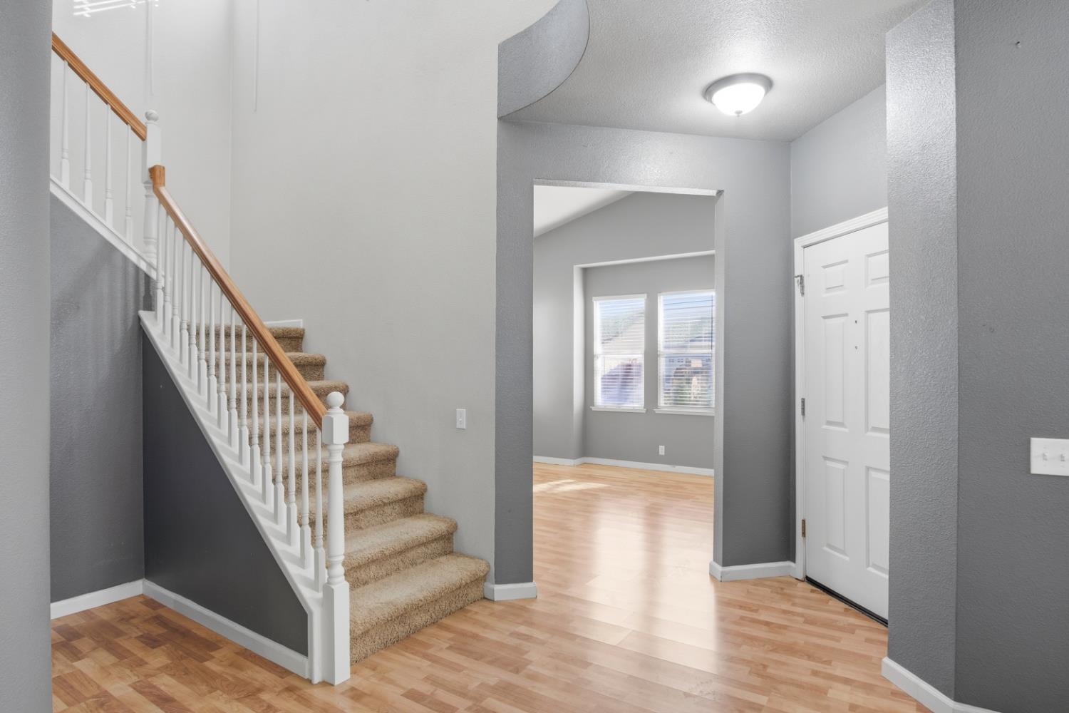 2213 Lionudakis Court Modesto, CA 95355 - Photo 7 of 38 a view of a hallway with wooden floor and entryway