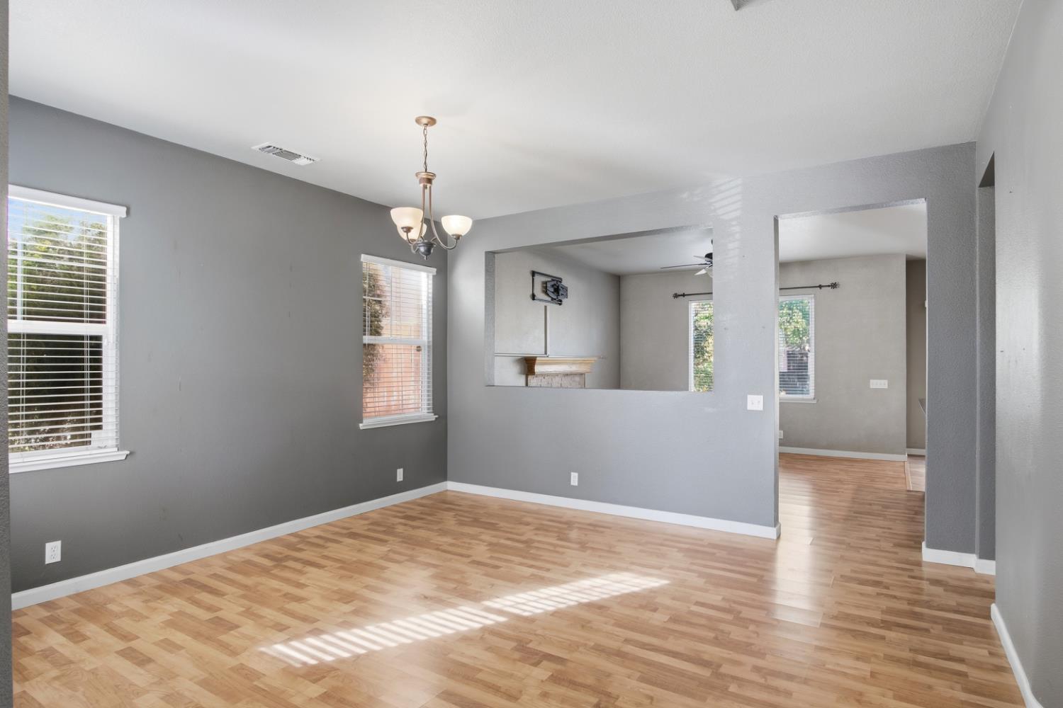 2213 Lionudakis Court Modesto, CA 95355 - Photo 8 of 38 a view of livingroom with hardwood floor and ceiling fan