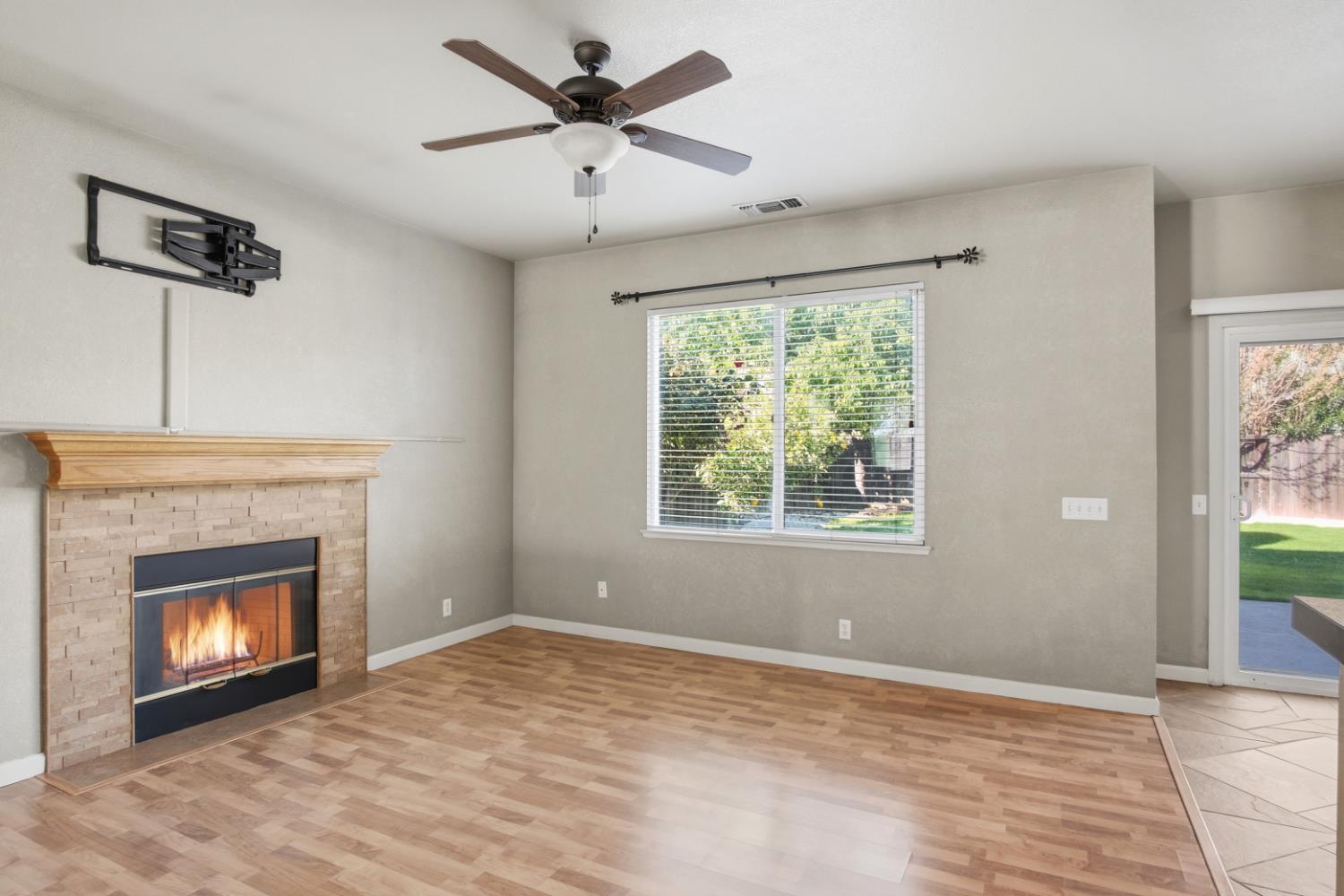 2213 Lionudakis Court Modesto, CA 95355 - Photo 10 of 38 a view of an empty room with window and fire place