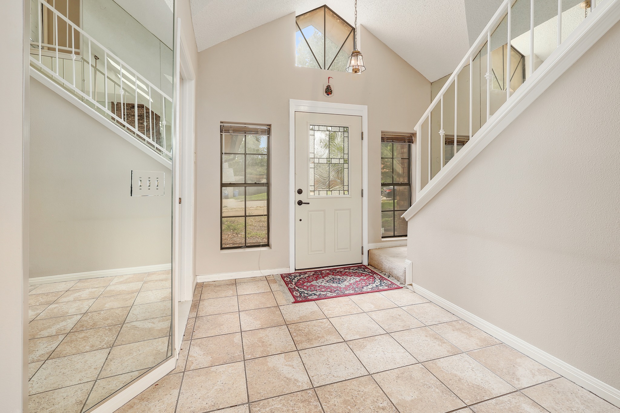 2202 Warfield Way Austin, TX 78728 - Photo 14 of 32 Enter into a bright foyer with vaulted ceilings and abundant natural light.