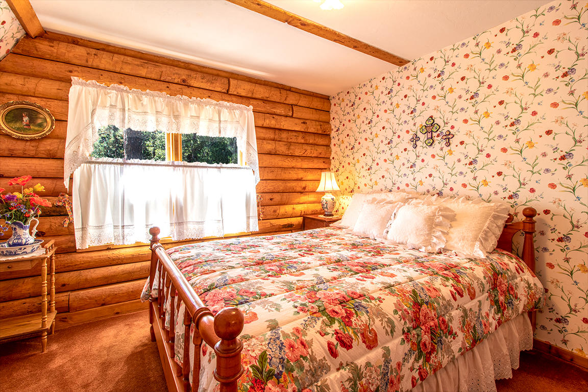 53174 Walters Drive Idyllwild, CA 92549 - Photo 14 of 55 a bedroom with a bed and a window with outer view