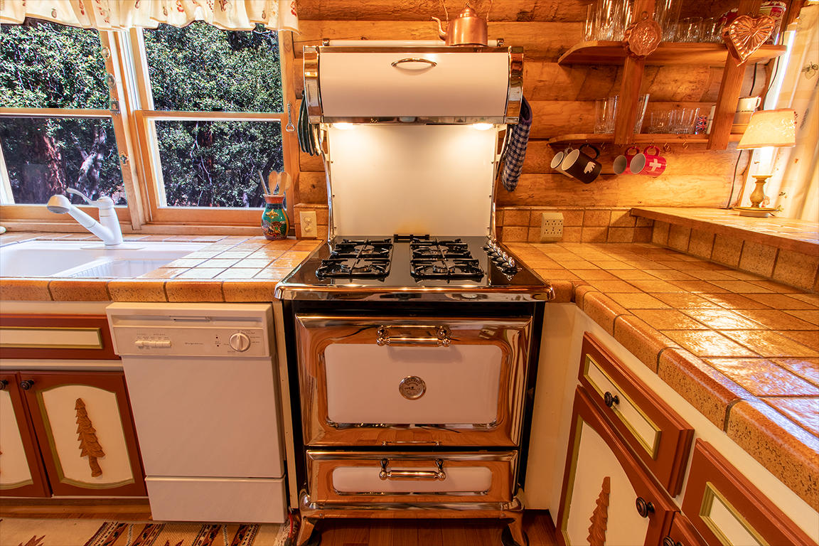 53174 Walters Drive Idyllwild, CA 92549 - Photo 35 of 55 a stove top oven sitting inside of a kitchen