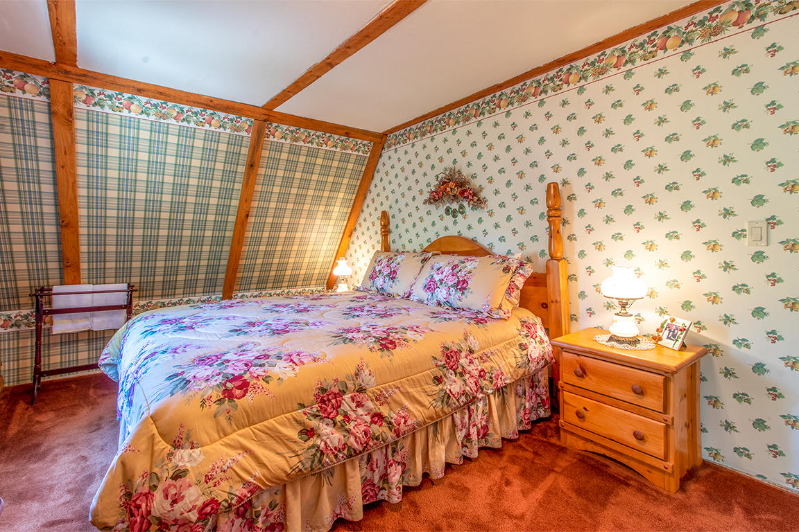 53174 Walters Drive Idyllwild, CA 92549 - Photo 45 of 55 a bedroom with a bed and a lamp next to a window