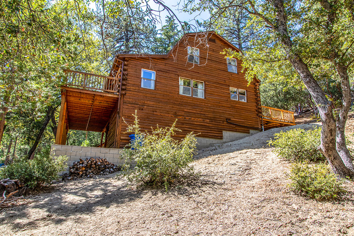 53174 Walters Drive Idyllwild, CA 92549 - Photo 55 of 55 a front view of a house with a yard and garage
