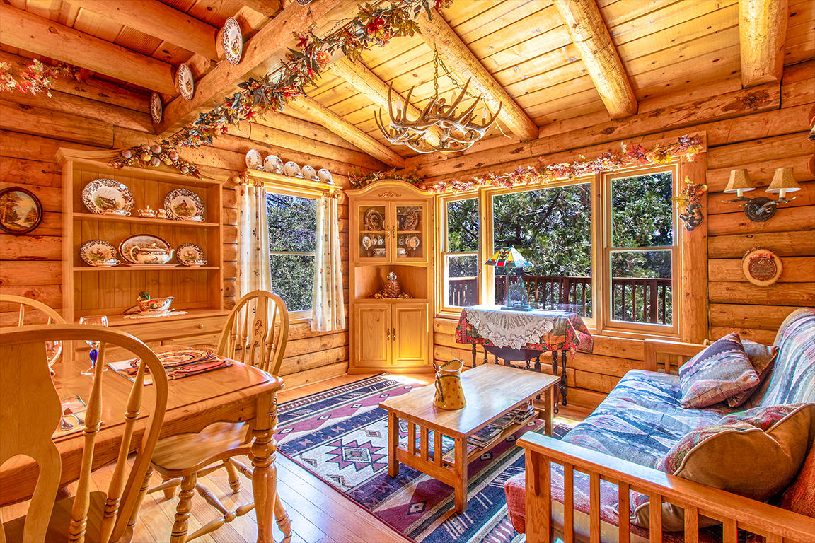 53174 Walters Drive Idyllwild, CA 92549 - Photo 6 of 55 a view of a patio with couches chairs and wooden floor