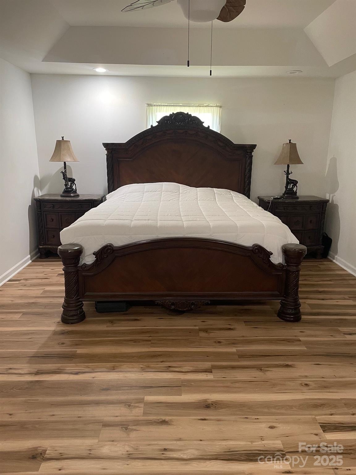 705 Sagrada Drive York, SC 29745 - Photo 11 of 26 a spacious bedroom with a bed and wooden floor