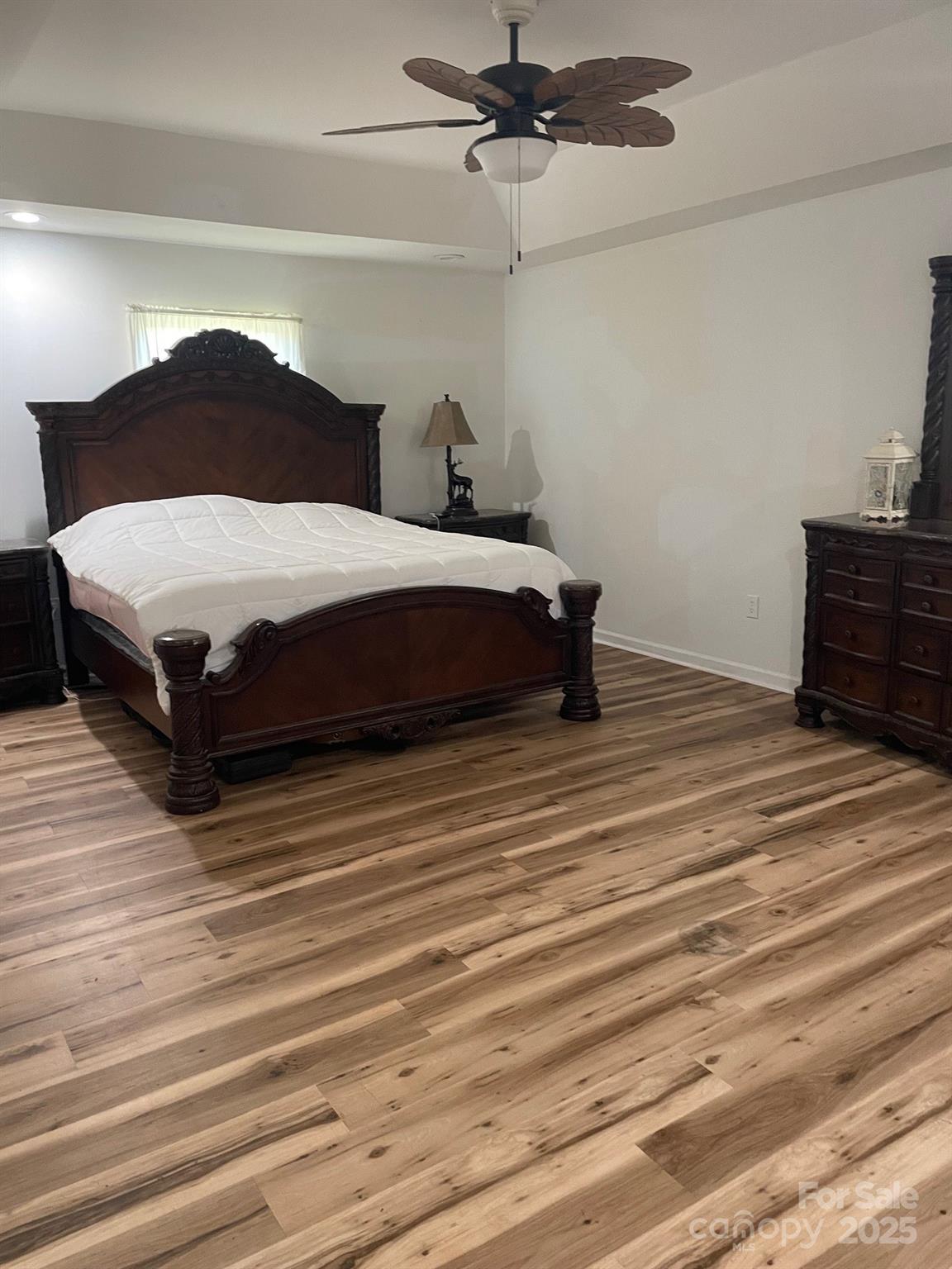 705 Sagrada Drive York, SC 29745 - Photo 12 of 26 a bedroom with a bed and wooden floor