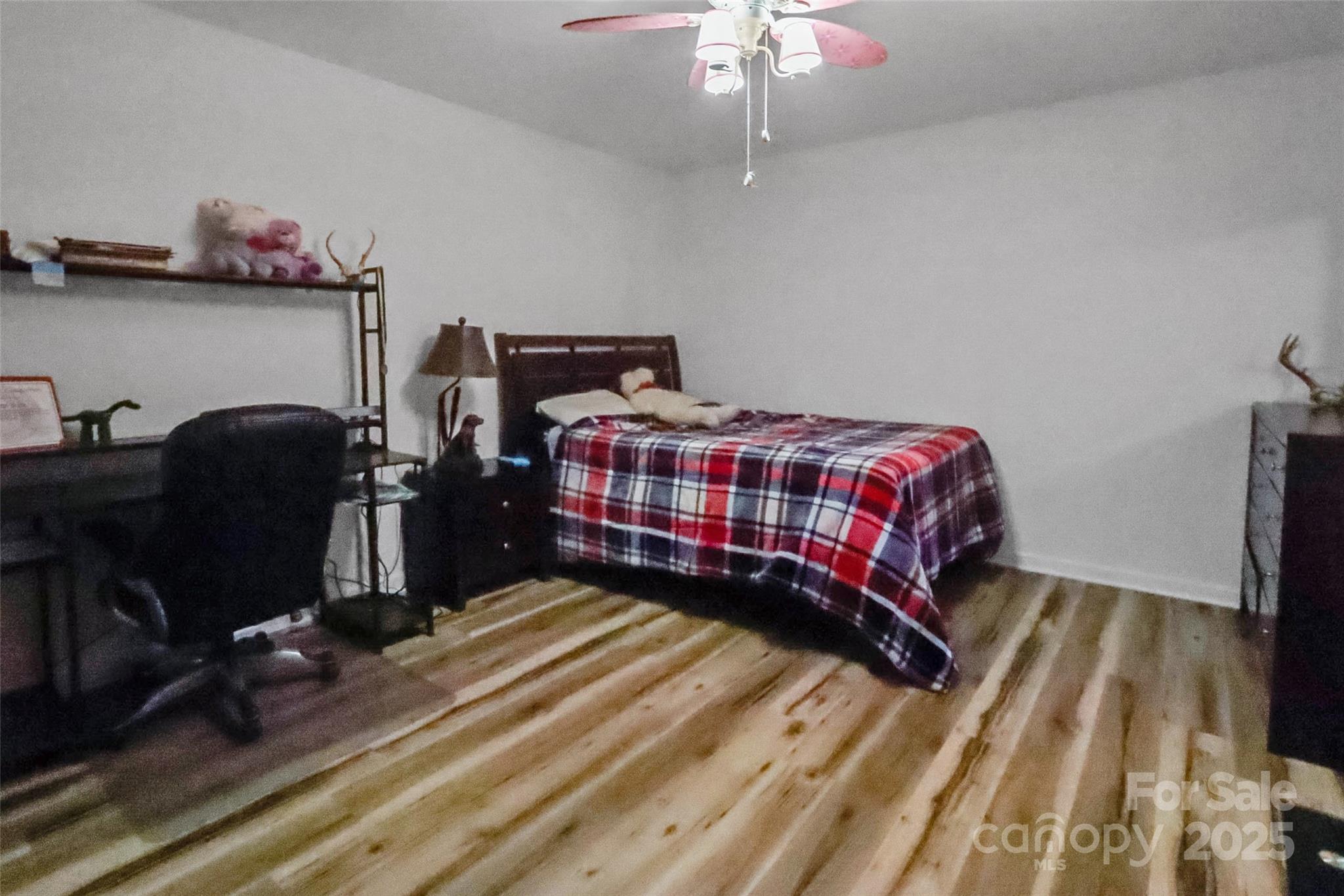 705 Sagrada Drive York, SC 29745 - Photo 18 of 26 a bedroom with a bed and a chandelier