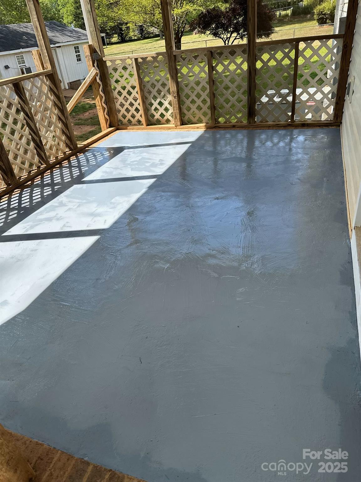 705 Sagrada Drive York, SC 29745 - Photo 20 of 26 a view of an empty room with wooden floor and windows