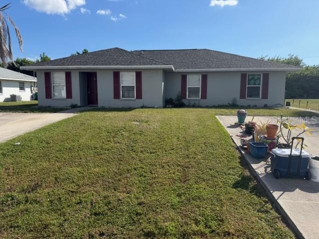 11089 Pendleton Avenue, Unit B Englewood, FL 34224 - Photo 1 of 19 a view of a house with swimming pool and chairs