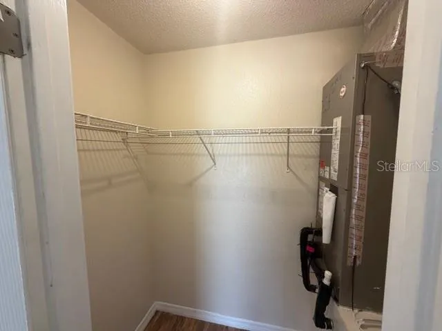 a bathroom with a sink a toilet a mirror a bathtub and shower